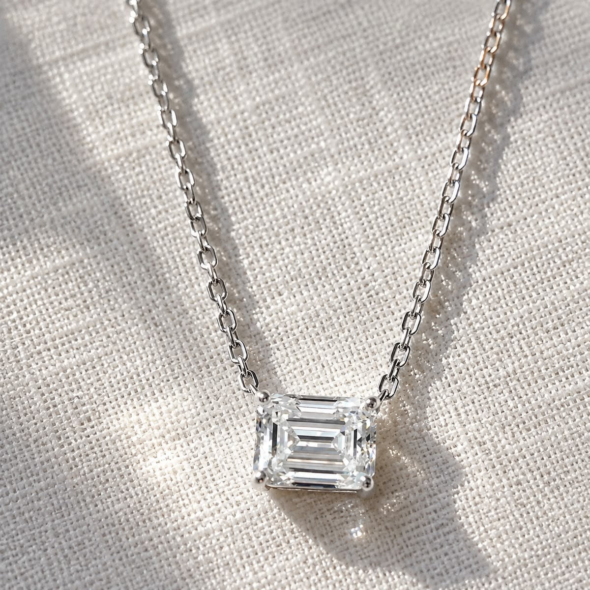 A single emerald-cut diamond pendant